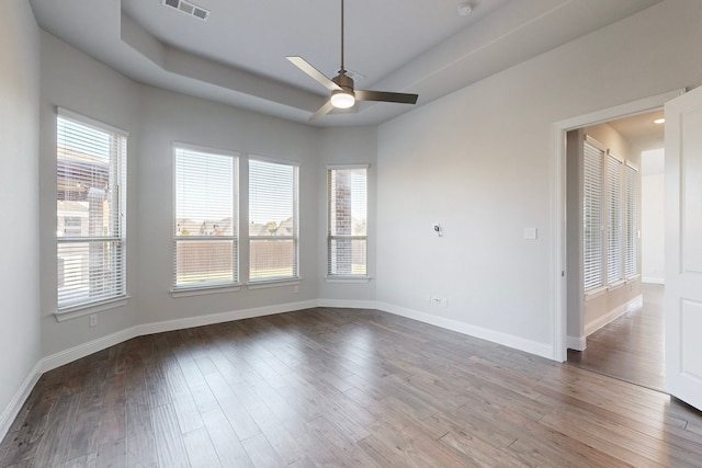 empty room featuring wood-type flooring and ceiling fan