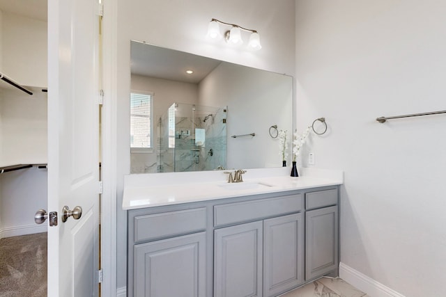 bathroom featuring vanity and a shower with shower door