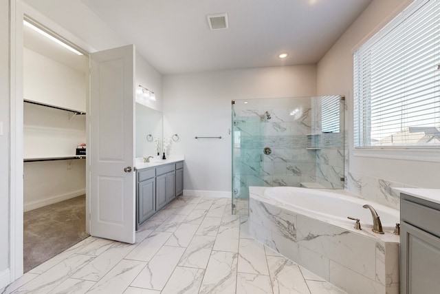 bathroom with vanity and plus walk in shower