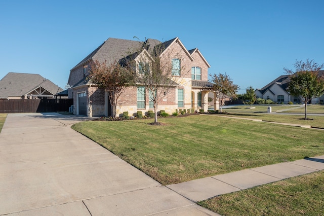 front facade with a front lawn and a garage