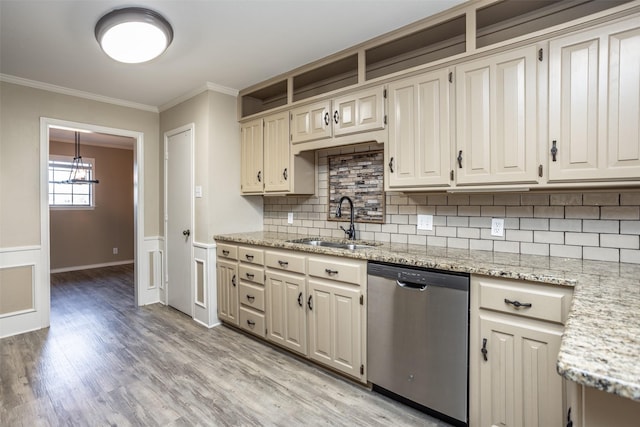 kitchen with sink, light hardwood / wood-style flooring, stainless steel dishwasher, decorative backsplash, and ornamental molding