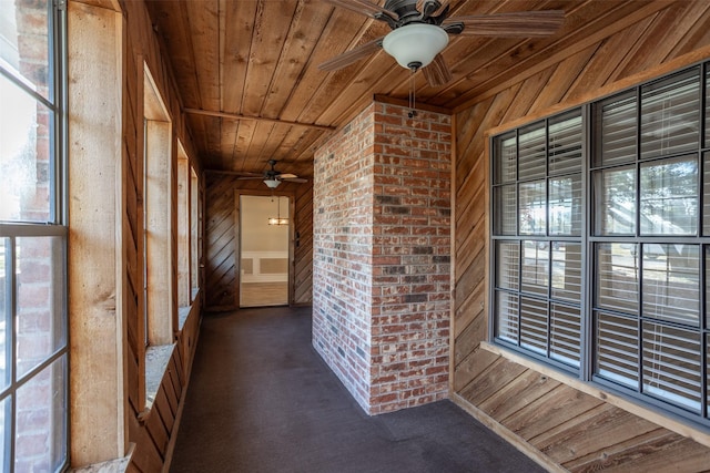 interior space with ceiling fan