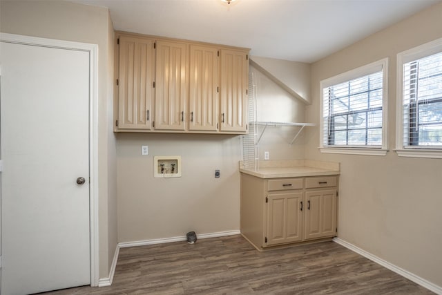 laundry area with washer hookup, hookup for an electric dryer, cabinets, and wood-type flooring