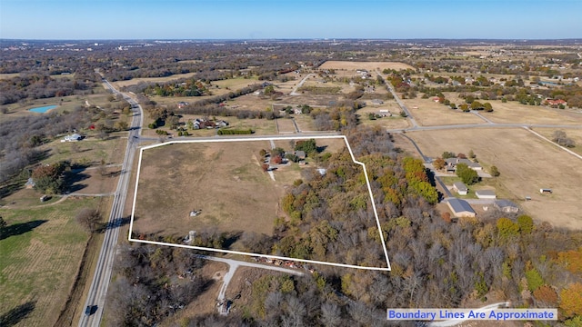 birds eye view of property with a water view and a rural view