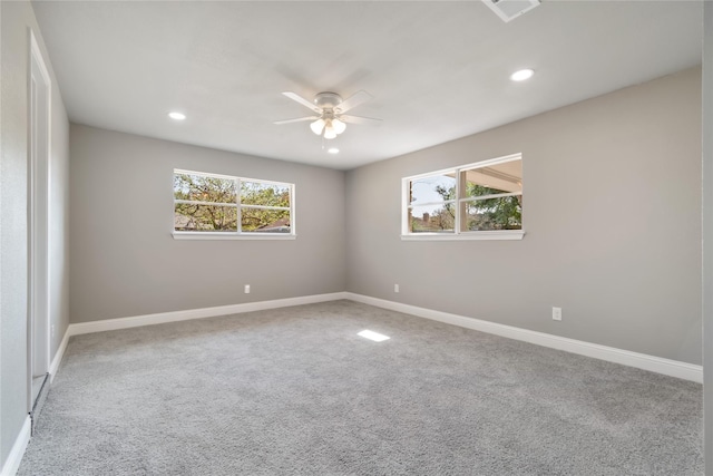 empty room featuring ceiling fan and carpet floors