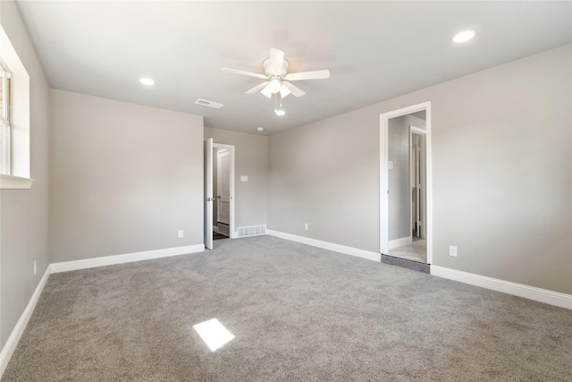 empty room featuring carpet and ceiling fan