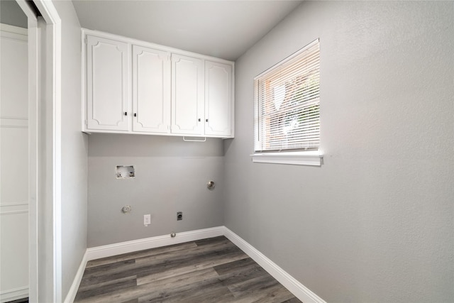 laundry area featuring cabinets, gas dryer hookup, hookup for a washing machine, hookup for an electric dryer, and dark hardwood / wood-style flooring