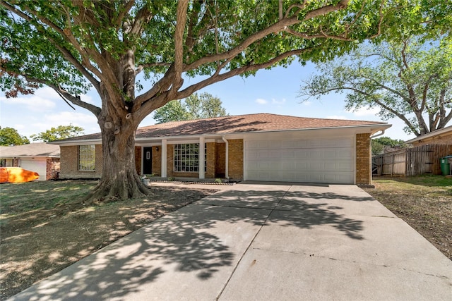 single story home featuring a garage