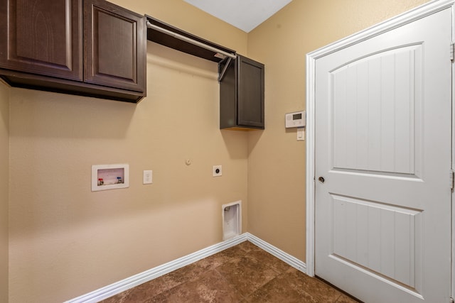 clothes washing area featuring cabinets, washer hookup, hookup for an electric dryer, hookup for a gas dryer, and dark tile patterned floors