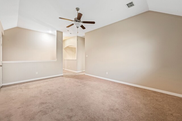 spare room with ceiling fan, carpet floors, and lofted ceiling