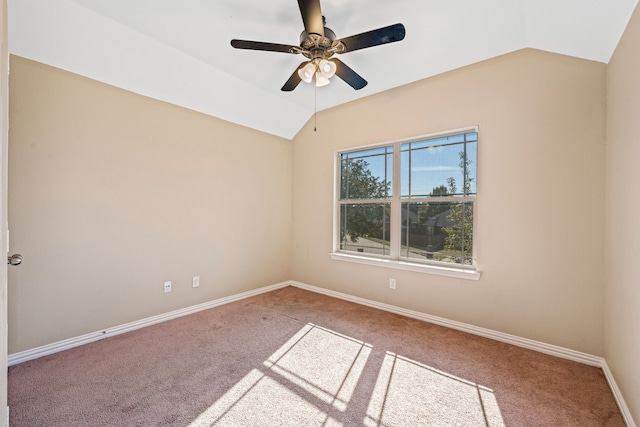 unfurnished room with vaulted ceiling, carpet, and ceiling fan