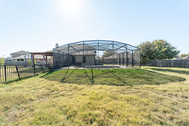 view of yard featuring a lanai and a swimming pool