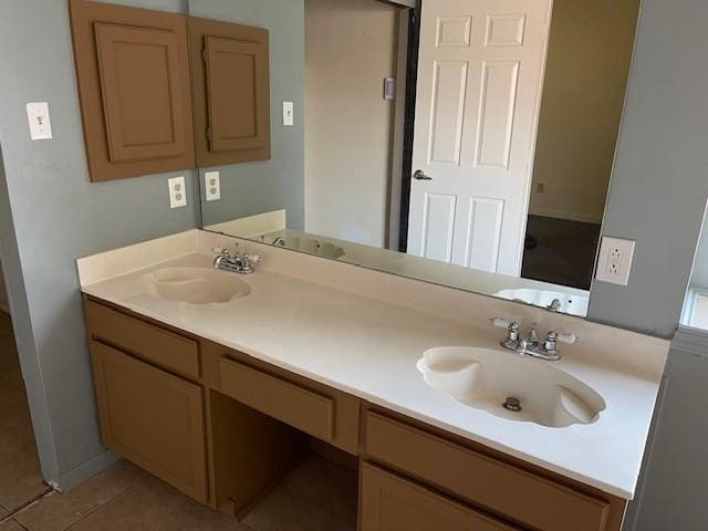 bathroom with tile patterned flooring and vanity