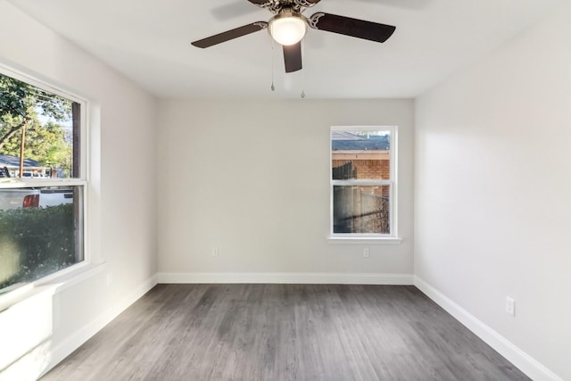 empty room with ceiling fan and hardwood / wood-style floors