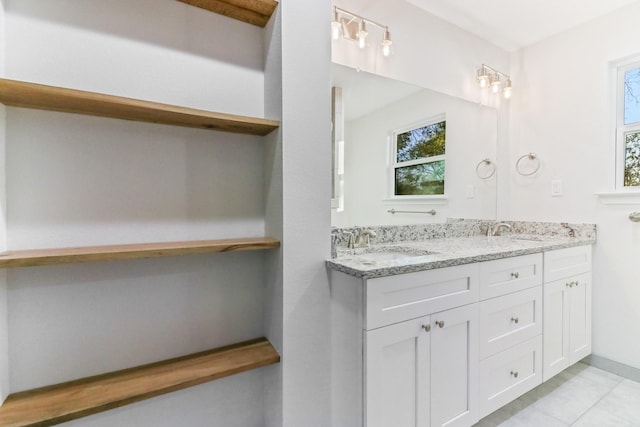 bathroom with tile patterned flooring and vanity