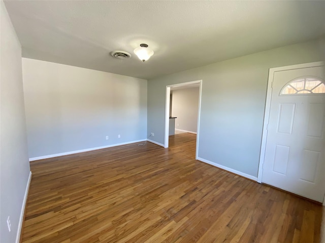 interior space with dark hardwood / wood-style flooring