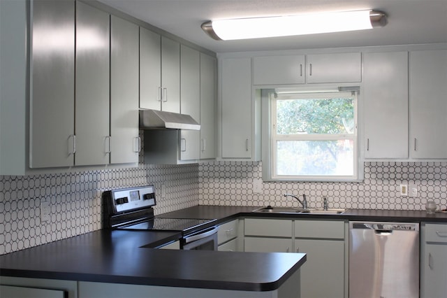 kitchen featuring white cabinets, sink, appliances with stainless steel finishes, and tasteful backsplash