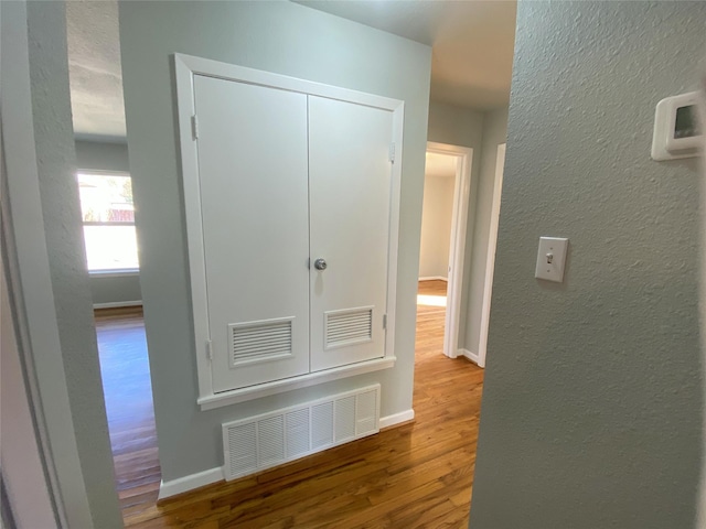 hallway featuring hardwood / wood-style flooring