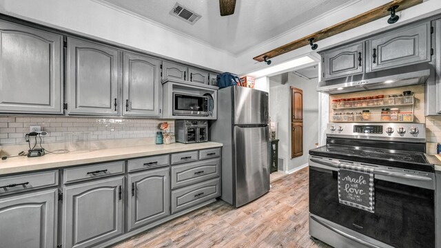 interior space with dark wood-type flooring, washing machine and dryer, and a textured ceiling