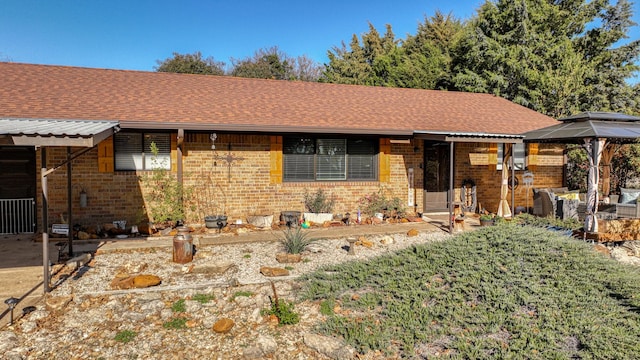 ranch-style home featuring a gazebo