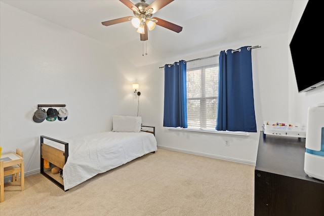 bedroom featuring vaulted ceiling, ceiling fan, and carpet flooring