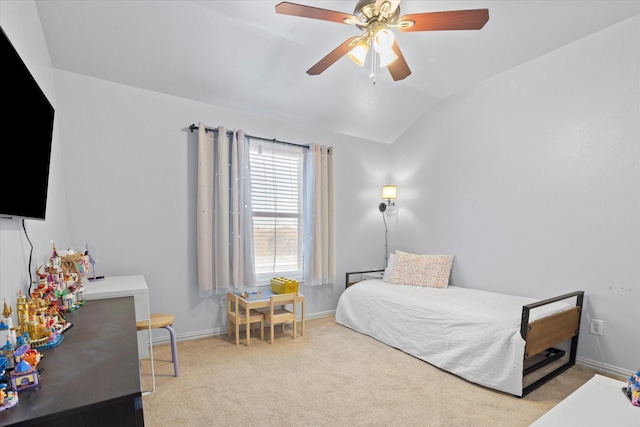 bedroom with ceiling fan, light colored carpet, and vaulted ceiling