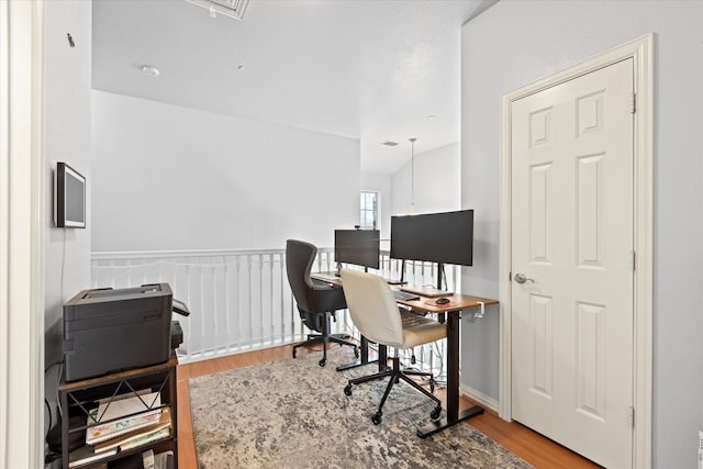 home office with hardwood / wood-style flooring