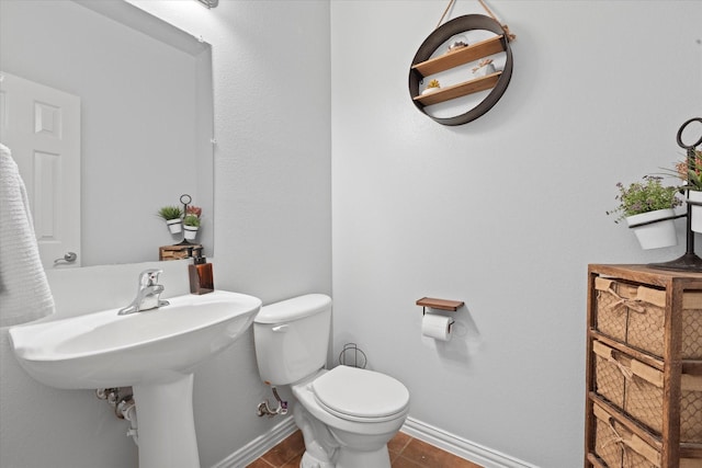 bathroom featuring tile patterned floors and toilet