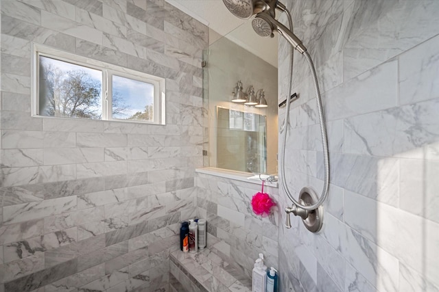 bathroom with a tile shower