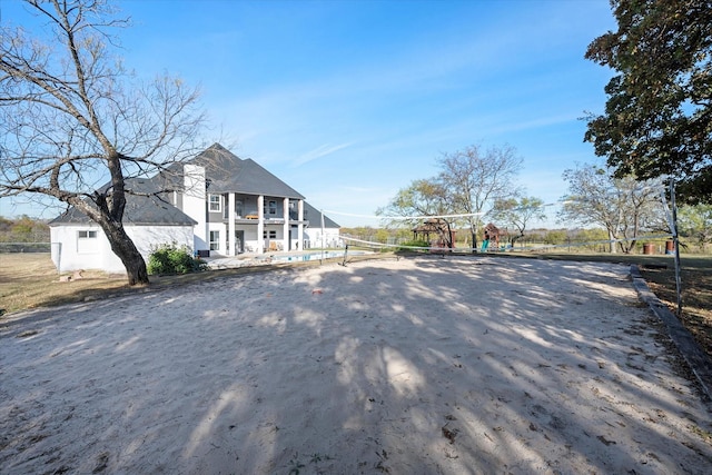 view of front of house featuring volleyball court