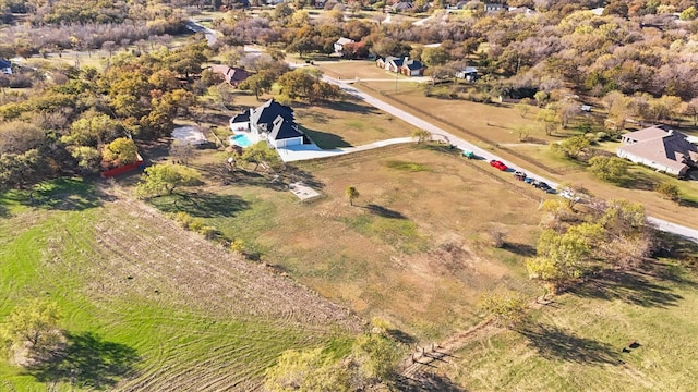 birds eye view of property featuring a rural view