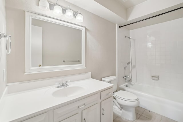 full bathroom with toilet, vanity, tile patterned floors, and tiled shower / bath