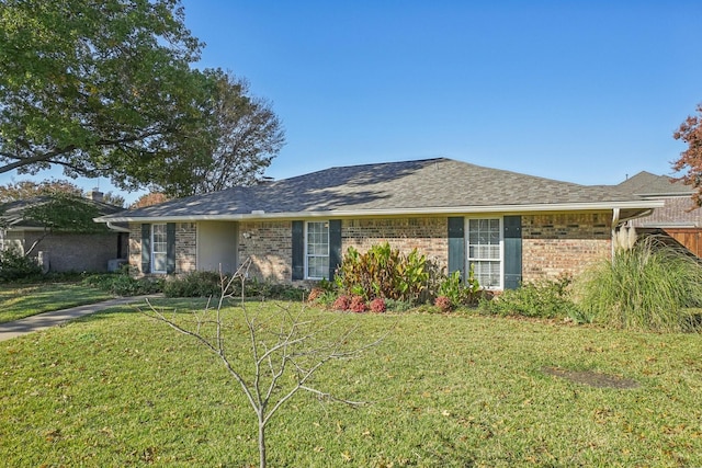 ranch-style house with a front lawn