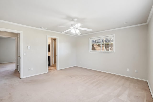 unfurnished bedroom with connected bathroom, ceiling fan, crown molding, and light colored carpet