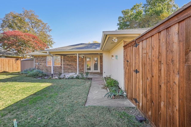 view of yard with french doors