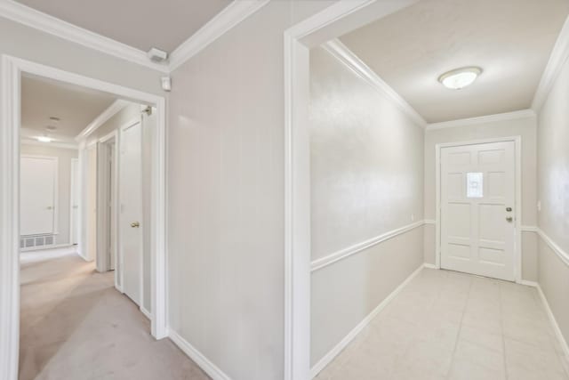 corridor featuring light carpet and crown molding