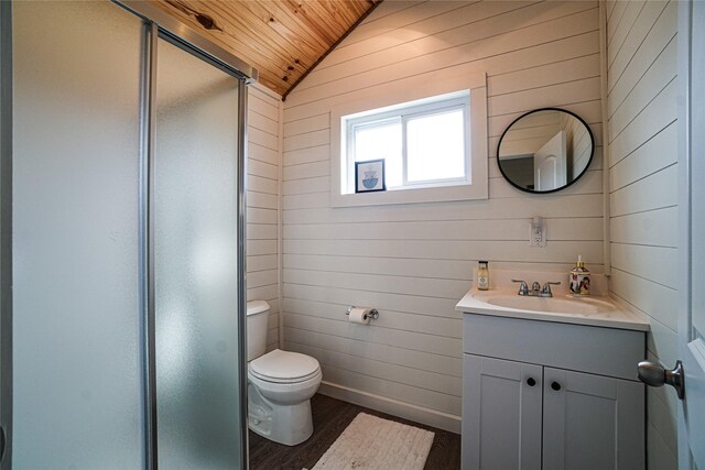 bathroom featuring vaulted ceiling, wood-type flooring, vanity, walk in shower, and toilet