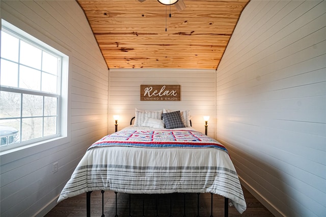 bedroom featuring lofted ceiling and wood ceiling