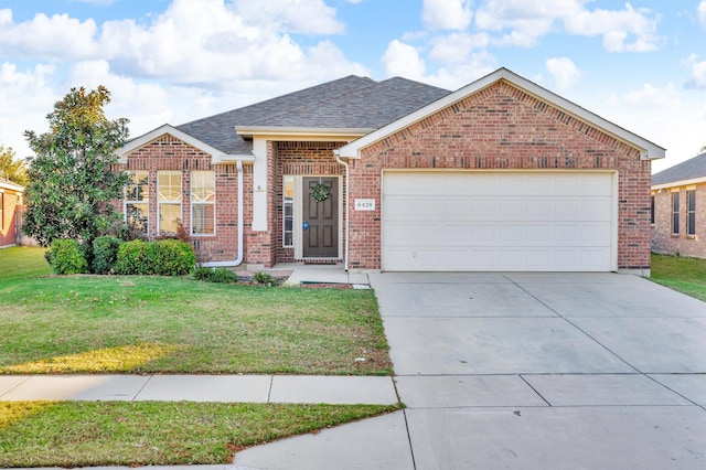 view of front of home featuring a garage and a front yard