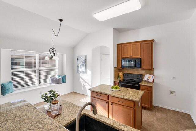 kitchen featuring hanging light fixtures, an inviting chandelier, backsplash, vaulted ceiling, and black appliances