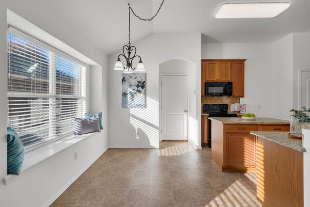 kitchen featuring light stone countertops, backsplash, pendant lighting, a notable chandelier, and lofted ceiling