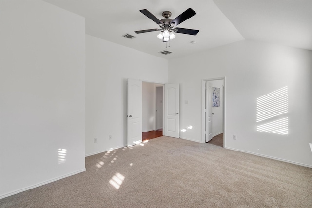 spare room with carpet flooring, ceiling fan, and lofted ceiling