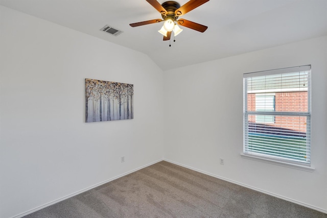 spare room with carpet flooring, ceiling fan, and lofted ceiling