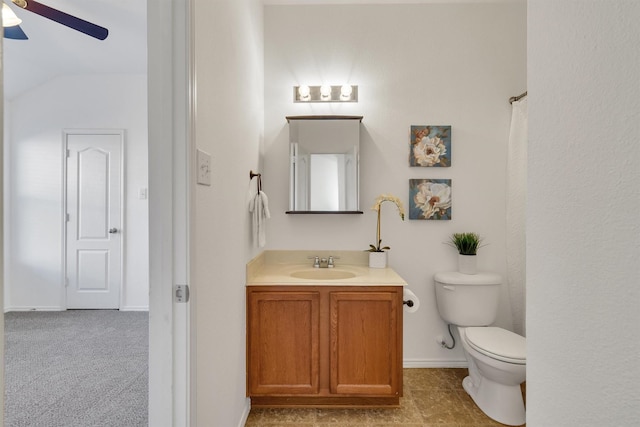 bathroom with ceiling fan, vanity, vaulted ceiling, and toilet