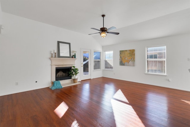 unfurnished living room featuring ceiling fan, hardwood / wood-style floors, and vaulted ceiling