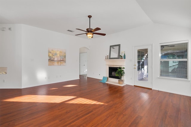 unfurnished living room with hardwood / wood-style floors, vaulted ceiling, and ceiling fan