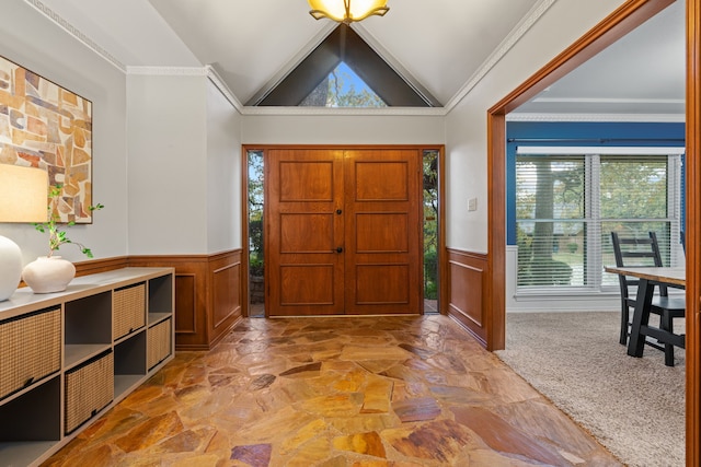 foyer with light carpet, crown molding, and lofted ceiling