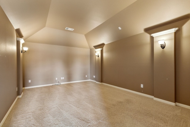 additional living space with carpet flooring and vaulted ceiling