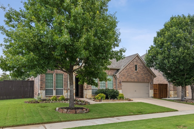 view of property hidden behind natural elements featuring a front lawn