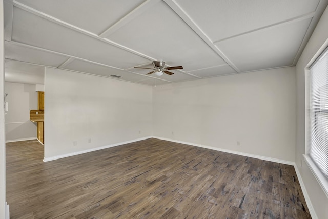 empty room featuring ceiling fan and dark wood-type flooring